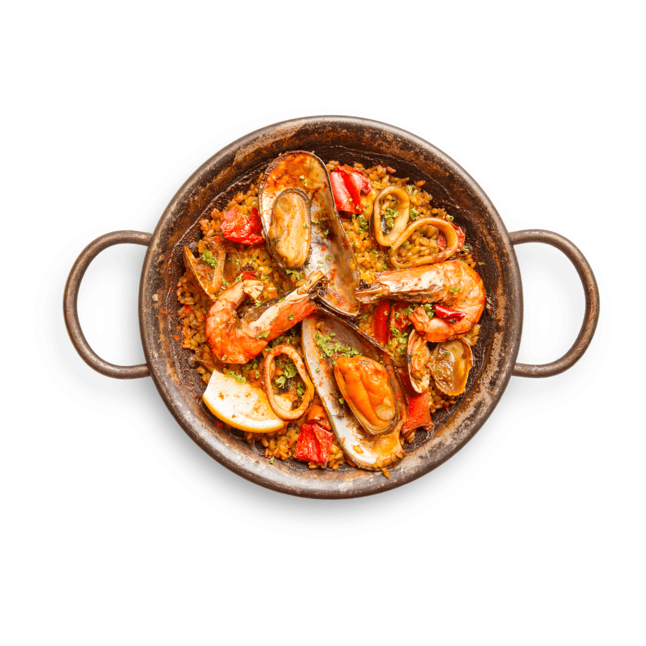 Paella tradicional servida en cazuela de hierro